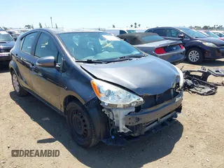 2014 Toyota Prius One z VIN JTDKDTB38E1560971, wystawiony jako IAAI lot #42309208 z przebiegiem 184 486 mil mil oraz . Historia ofert i sprzedaży dostępna na DreamBid. Obrazek 1.