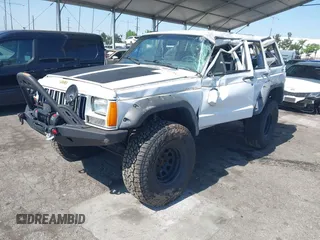 1991 Jeep Cherokee Country z VIN 1J4FJ78S7ML632675, wystawiony jako IAAI lot #42283175 z przebiegiem 116 062 mil mil oraz . Historia ofert i sprzedaży dostępna na DreamBid. Obrazek 17.