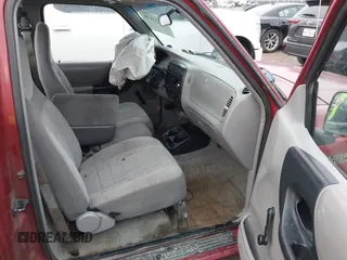 1997 Ford Ranger XLT z VIN 1FTCR10A9VUB45863, wystawiony jako IAAI lot #42133970 z przebiegiem 241 301 mil mil oraz . Historia ofert i sprzedaży dostępna na DreamBid. Obrazek 5.