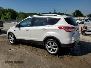 2015 Ford Escape Titanium with VIN 1FMCU0J93FUA58325, listed as a Copart auction lot 64135685 with 126,356 mi miles and Salvage title. Bid and sale history available at DreamBid. Image 2.