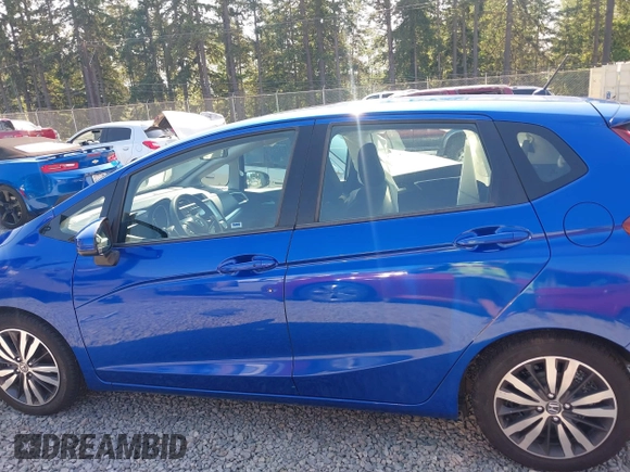 2015 Honda Fit EX-L z VIN 3HGGK5H83FM732503, wystawiony jako IAAI lot #42397823 z przebiegiem 87 522 mil mil oraz . Historia ofert i sprzedaży dostępna na DreamBid. Obrazek 14.