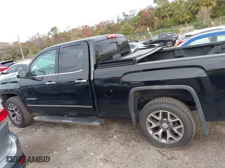 2014 GMC Sierra 1500 SLT with VIN 1GTV2VEJXEZ389280, listed as a IAAI auction lot 41370436 with 124,311 mi miles. Bid and sale history available at carsss.com. Image 14.
