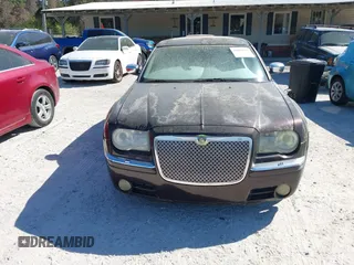 2005 Chrysler 300 with VIN 2C3AA63H75H577363, listed as a IAAI auction lot 41892999 with 229,634 mi miles. Bid and sale history available at carsss.com. Image 6.