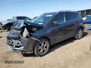 2016 Ford Escape Titanium z VIN 1FMCU9J91GUB01288, wystawiony jako Copart lot #62472875 z przebiegiem 67 854 mil mil oraz Szkoda całkowita • Salvage title. Historia ofert i sprzedaży dostępna na DreamBid. Obrazek 1.