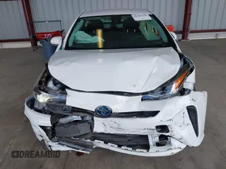 2021 Toyota Prius L Eco z VIN JTDKAMFU5M3146342, wystawiony jako IAAI lot #42249219 z przebiegiem 49 810 mil mil oraz . Historia ofert i sprzedaży dostępna na DreamBid. Obrazek 12.
