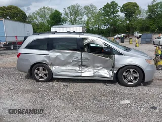 2012 Honda Odyssey Touring с VIN 5FNRL5H90CB083157, выставлен на аукционе IAAI как лот 42176609 с пробегом 250 000 миль миль и . История ставок и продаж доступна на DreamBid. Изображение 13.