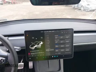 2021 Tesla Model Y Performance with VIN 5YJYGDEF1MF262930, listed as a IAAI auction lot 41606321 with 28,882 mi miles and . Bid and sale history available at DreamBid. Image 18.
