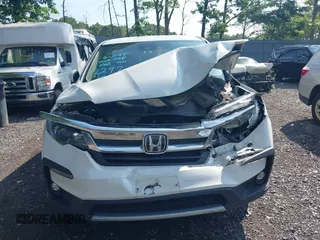 2021 Honda Pilot EX with VIN 5FNYF6H38MB072297, listed as a IAAI auction lot 42561276 with 119,172 mi miles and . Bid and sale history available at DreamBid. Image 12.