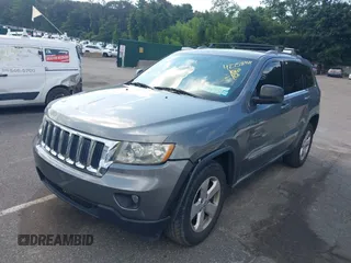 2011 Jeep Grand Cherokee Laredo with VIN 1J4RR4GG7BC736694, listed as a IAAI auction lot 42758461 with 159,875 mi miles and . Bid and sale history available at DreamBid. Image 2.