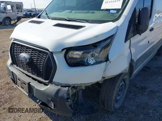 2022 Ford Transit Cargo with VIN 1FTYE1YG3NKA77243, listed as a IAAI auction lot 41231977 with 55,300 mi miles and . Bid and sale history available at DreamBid. Image 6.