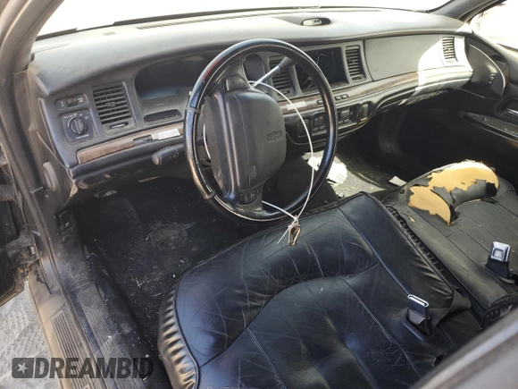 1997 Lincoln Town Car Executive z VIN 1LNLM81W0VY678786, wystawiony jako Copart lot #64906284 z przebiegiem Nie podano mil oraz Szkody całkowita. Historia ofert i sprzedaży dostępna na DreamBid. Obrazek 8.