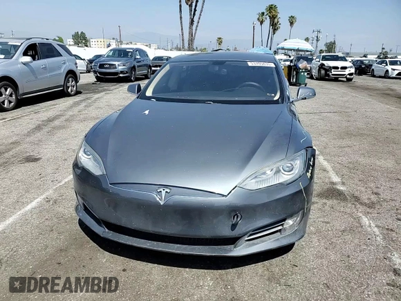 2014 Tesla Model S 60 z VIN 5YJSA1H17EFP36595, wystawiony jako Copart lot #53705035 z przebiegiem 148 254 mil mil oraz Szkoda całkowita • Salvage title. Historia ofert i sprzedaży dostępna na DreamBid. Obrazek 13.