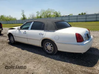2001 Lincoln Town Car Cartier z VIN 1LNHM83W91Y728971, wystawiony jako Copart lot #50643965 z przebiegiem Nie podano mil oraz Szkoda całkowita • Salvage title. Historia ofert i sprzedaży dostępna na DreamBid. Obrazek 2.