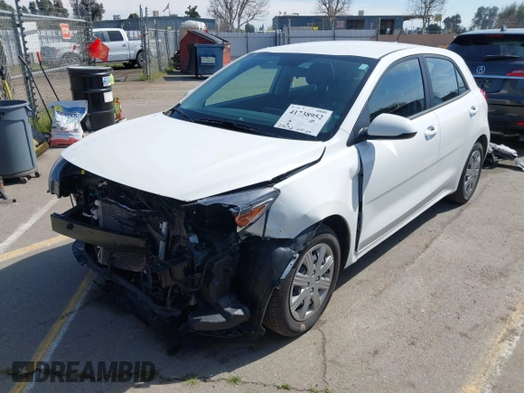 2023 Kia Rio S with VIN 3KPA25AD0PE629868, listed as a IAAI auction lot 41738952 with 25,642 mi miles and . Bid and sale history available at DreamBid. Image 2.
