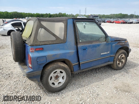1993 Geo Tracker z VIN 2CNBJ18UXP6921660, wystawiony jako Copart lot #58027275 z przebiegiem 64 349 mil mil oraz Tytuł czysty. Historia ofert i sprzedaży dostępna na DreamBid. Obrazek 3.