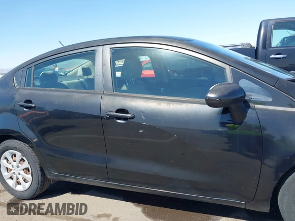 2014 Kia Rio LX with VIN KNADM4A39E6364490, listed as a IAAI auction lot 42128702 with 130,981 mi miles and . Bid and sale history available at DreamBid. Image 14.