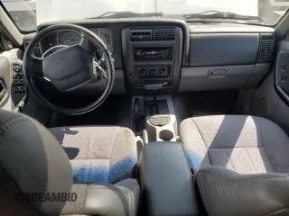 1998 Jeep Cherokee Sport with VIN 1J4FJ68S1WL259582, listed as a Copart auction lot 68115624 with 235,380 mi miles and Salvage Title. Bid and sale history available at carsss.com. Image 8.