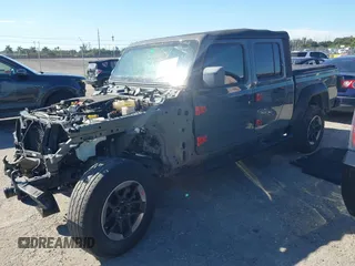 2021 Jeep Gladiator Willys with VIN 1C6HJTAG4ML517715, listed as a IAAI auction lot 41436634 with 21,187 mi miles and . Bid and sale history available at DreamBid. Image 2.