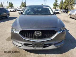 2020 Mazda CX-5 Touring with VIN JM3KFACM9L0815692, listed as a Copart auction lot 52431295 with 59,359 mi miles and Salvage Title. Bid and sale history available at DreamBid. Image 5.