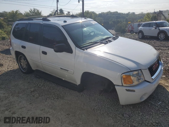 2005 GMC Envoy SLT with VIN 1GKDT13S552329269, listed as a Copart auction lot 69209244 with 154,595 mi miles and Salvage Title. Bid and sale history available at carsss.com. Image 4.