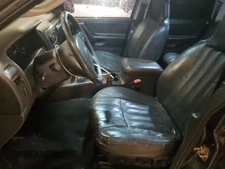 2003 Jeep Grand Cherokee Laredo with VIN 1J4GX48S13C601387, listed as a Copart auction lot 60544295 with 217,485 mi miles and Salvage title. Bid and sale history available at DreamBid. Image 7.