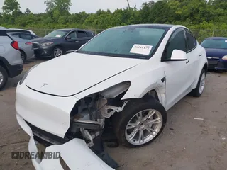 2023 Tesla Model Y Long Range with VIN 7SAYGDEE4PF770307, listed as a IAAI auction lot 42141175 with 34,901 mi miles and . Bid and sale history available at carsss.com. Image 20.