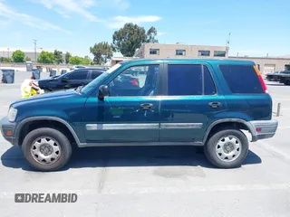 1998 Honda CR-V LX z VIN JHLRD1843WC083751, wystawiony jako IAAI lot #42356438 z przebiegiem 167 342 mil mil oraz . Historia ofert i sprzedaży dostępna na DreamBid. Obrazek 14.