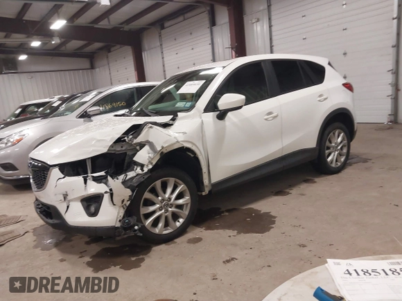 2014 Mazda CX-5 Grand Touring with VIN JM3KE4DY3E0374036, listed as a IAAI auction lot 41889030 with 162,611 mi miles and . Bid and sale history available at DreamBid. Image 17.