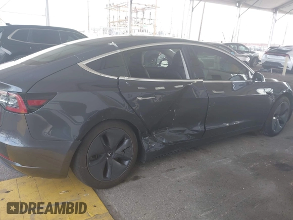 2020 Tesla Model 3 Standard Range Plus with VIN 5YJ3E1EA8LF743405, listed as a IAAI auction lot 41923592 with 81,901 mi miles. Bid and sale history available at carsss.com. Image 6.