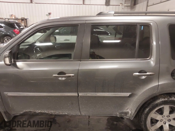 2012 Honda Pilot Touring with VIN 5FNYF4H98CB030879, listed as a IAAI auction lot 41619003 with 201,131 mi miles. Bid and sale history available at carsss.com. Image 14.