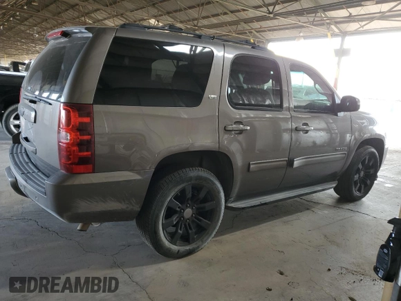 2014 Chevrolet Tahoe LT with VIN 1GNSCBE06ER245772, listed as a Copart auction lot 53747375 with 221,139 mi miles and Salvage title. Bid and sale history available at DreamBid. Image 3.