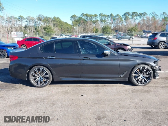 2018 BMW 5 Series M550i xDrive with VIN WBAJB9C57JG463933, listed as a IAAI auction lot 41295711 with 99,173 mi miles and . Bid and sale history available at carsss.com. Image 13.