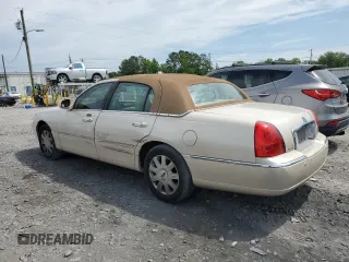 2003 Lincoln Town Car Cartier z VIN 1LNHM83W33Y690270, wystawiony jako Copart lot #51682235 z przebiegiem 118 355 mil mil oraz Szkoda całkowita • Salvage title. Historia ofert i sprzedaży dostępna na DreamBid. Obrazek 2.