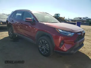 2024 Toyota RAV4 Hybrid XLE Premium with VIN JTMB6RFVXRD120389, listed as a Copart auction lot 47596985 with 16,956 mi miles and Salvage Title. Bid and sale history available at DreamBid. Image 4.