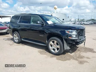 2015 Chevrolet Tahoe LT with VIN 1GNSCBKCXFR214072, listed as a IAAI auction lot 40512435 with 98,955 mi miles and . Bid and sale history available at DreamBid. Image 1.