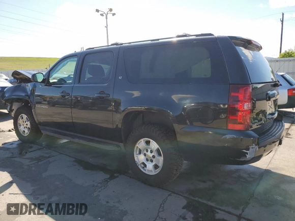 2013 Chevrolet Suburban LT with VIN 1GNSKJE70DR138631, listed as a Copart auction lot 57778185 with 176,934 mi miles and Salvage title. Bid and sale history available at DreamBid. Image 2.