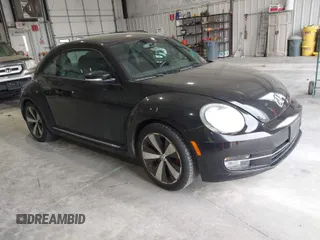 2012 Volkswagen Beetle 2.0T Turbo w/Sun/Snd/Nav PZEV with VIN 3VWVA7AT8CM617830, listed as a IAAI auction lot 42024546 with 91,688 mi miles. Bid and sale history available at carsss.com. Image 1.
