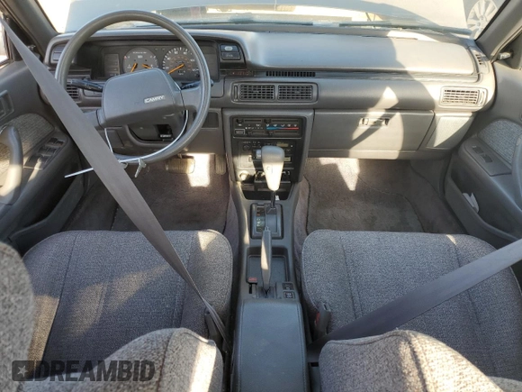 1989 Toyota Camry z VIN JT2SV21E8K0314703, wystawiony jako Copart lot #76053194 z przebiegiem 124 873 mil mil oraz Nie do naprawy • Non repairable. Historia ofert i sprzedaży dostępna na DreamBid. Obrazek 8.