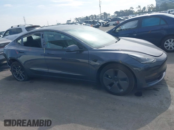 2023 Tesla Model 3 z VIN 5YJ3E1EA0PF577869, wystawiony jako IAAI lot #41468956 z przebiegiem 38 760 mil mil oraz . Historia ofert i sprzedaży dostępna na DreamBid. Obrazek 13.