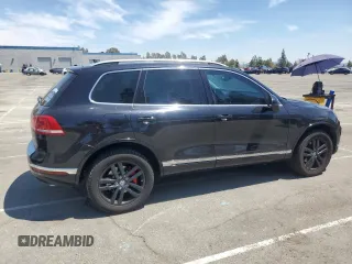 2016 Volkswagen Touareg Sport with VIN WVGEF9BP0GD007399, listed as a Copart auction lot 53990675 with 110,439 mi miles and Salvage Title. Bid and sale history available at DreamBid. Image 3.