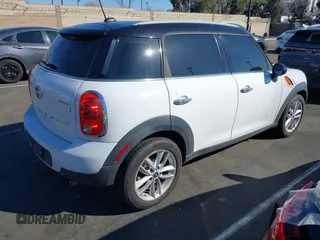 2014 MINI Countryman with VIN WMWZB3C53EWR39767, listed as a IAAI auction lot 41592112 with 129,403 mi miles and . Bid and sale history available at DreamBid. Image 4.