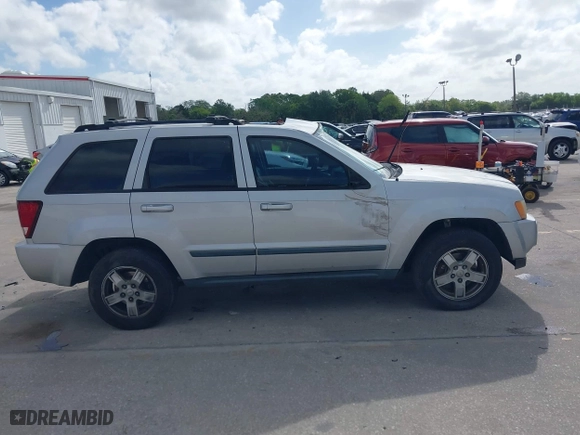 2007 Jeep Grand Cherokee Laredo with VIN 1J8GS48K57C545151, listed as a IAAI auction lot 41959178 with 148,534 mi miles. Bid and sale history available at carsss.com. Image 13.