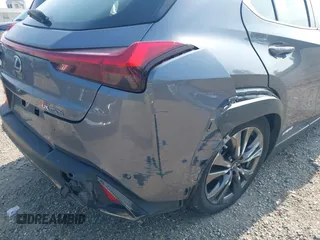 2021 Lexus UX 250h F Sport z VIN JTHE9JBHXM2045377, wystawiony jako IAAI lot #42580566 z przebiegiem 52 838 mil mil oraz . Historia ofert i sprzedaży dostępna na DreamBid. Obrazek 19.