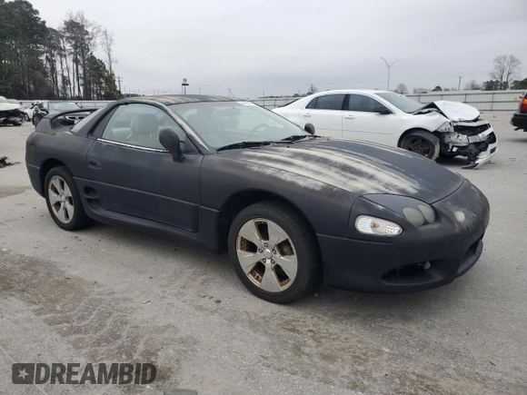 1998 Mitsubishi 3000GT z VIN JA3AM44H8WY000594, wystawiony jako Copart lot #44164155 z przebiegiem 92 227 mil mil oraz Czysty tytuł • Clean title. Historia ofert i sprzedaży dostępna na DreamBid. Obrazek 4.