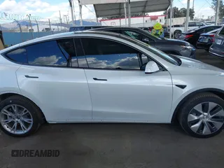 2024 Tesla Model Y Long Range with VIN 7SAYGDEE5RA222333, listed as a IAAI auction lot 41944404 with 12,176 mi miles. Bid and sale history available at carsss.com. Image 14.