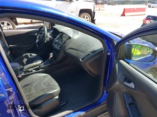 2015 Ford Focus Titanium with VIN 1FADP3J20FL304828, listed as a IAAI auction lot 42144101 with 199,715 mi miles and . Bid and sale history available at carsss.com. Image 5.