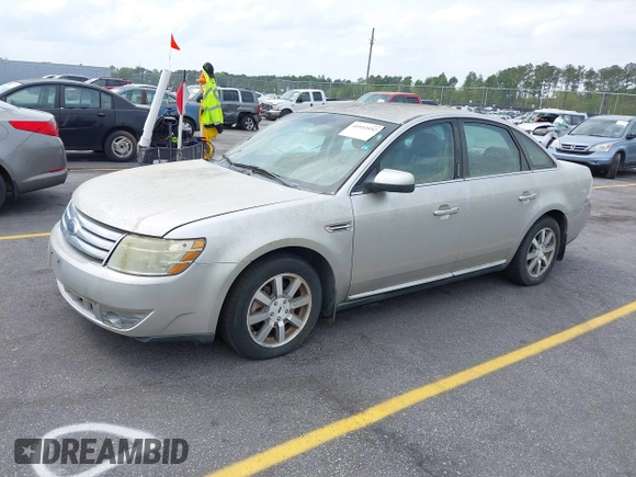 2008 Ford Taurus SEL with VIN 1FAHP24W88G178210, listed as a IAAI auction lot 41933552 with 142,971 mi miles. Bid and sale history available at carsss.com. Image 2.
