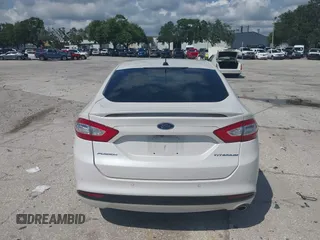 2013 Ford Fusion Titanium with VIN 3FA6P0SU0DR239890, listed as a IAAI auction lot 42745530 with 129,458 mi miles and . Bid and sale history available at DreamBid. Image 16.