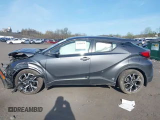 2022 Toyota C-HR XLE z VIN NMTKHMBXXNR145682, wystawiony jako IAAI lot #42104874 z przebiegiem 88 141 mil mil oraz . Historia ofert i sprzedaży dostępna na DreamBid. Obrazek 14.