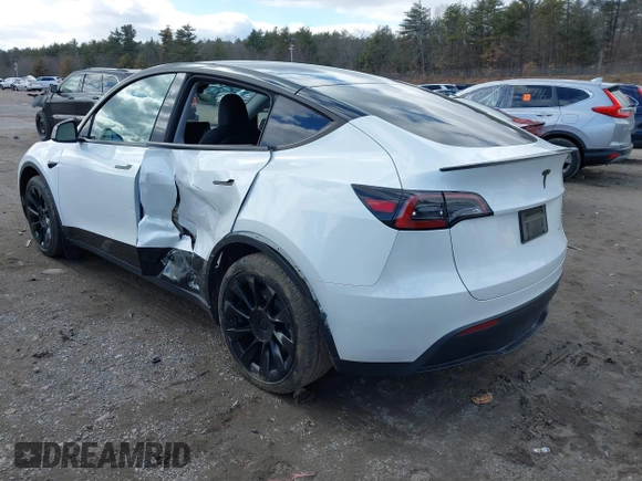 2023 Tesla Model Y Long Range with VIN 7SAYGDEE7PF832007, listed as a IAAI auction lot 41751598 with 14,126 mi miles and . Bid and sale history available at DreamBid. Image 3.